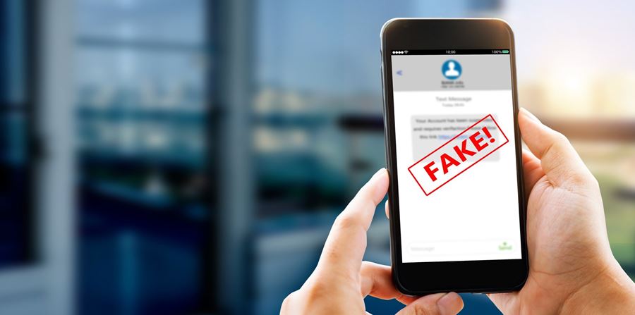 fake text message sms scam or phishing concept man hands using smart phone